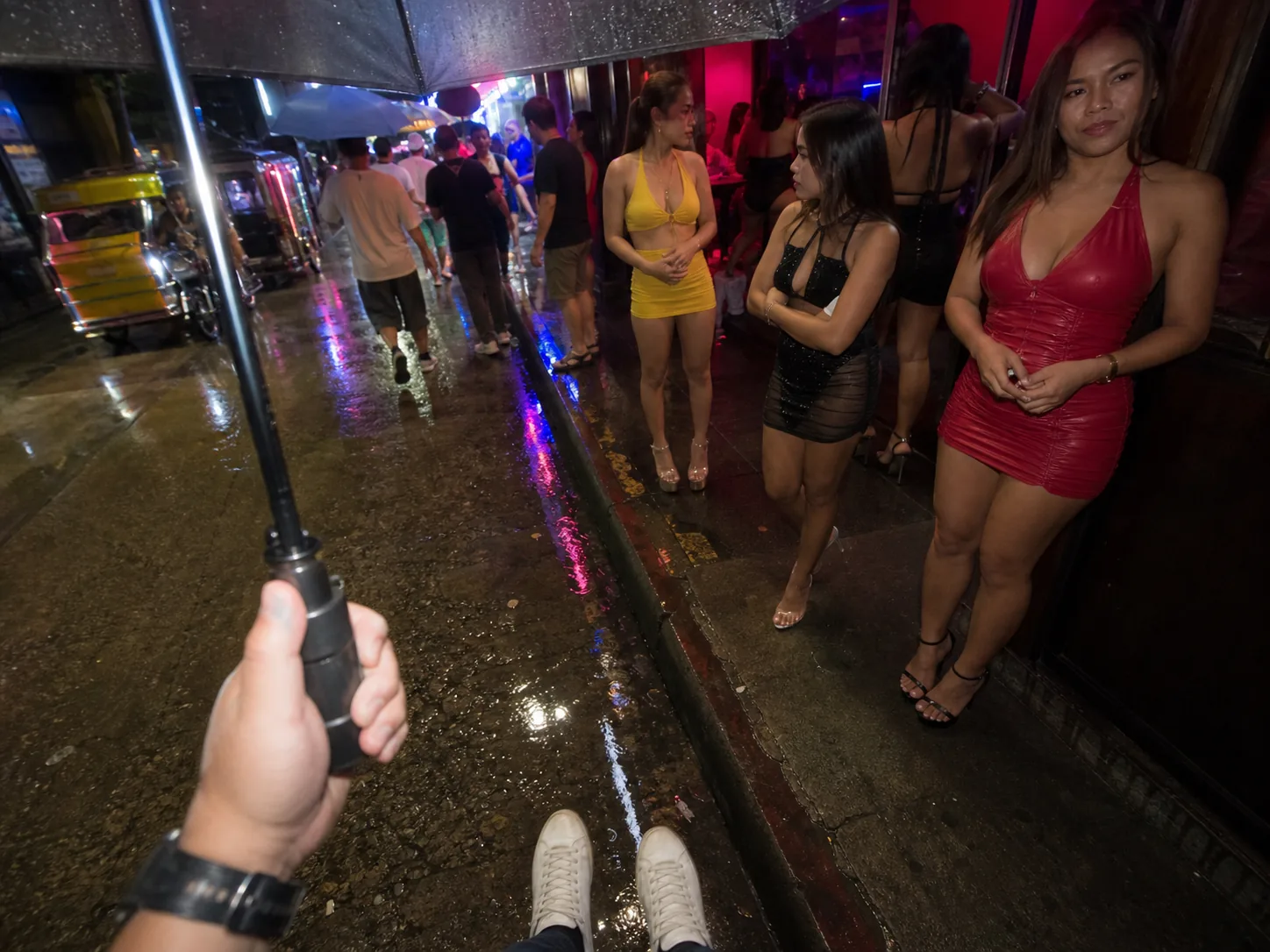 Walking Street club lineup outside neon venue
